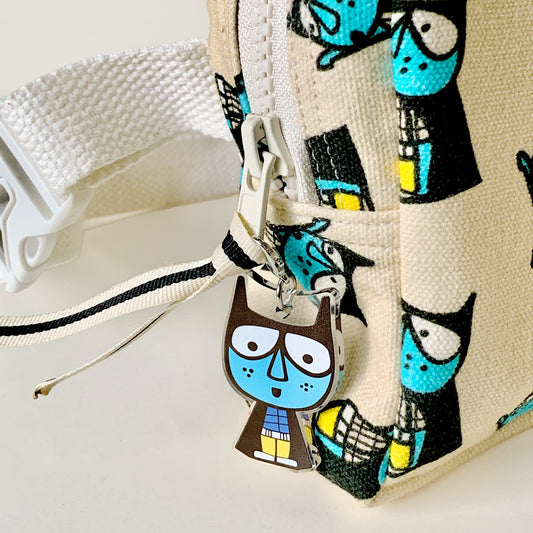 Mapayah CHARMS Superboy keychain clipped onto a bag
