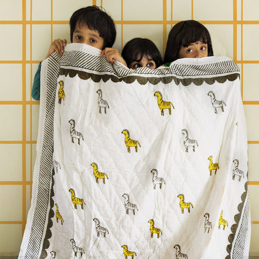 Mapayah SNUGGLE Zany Zebra kids blanket styled in a bedroom setting
