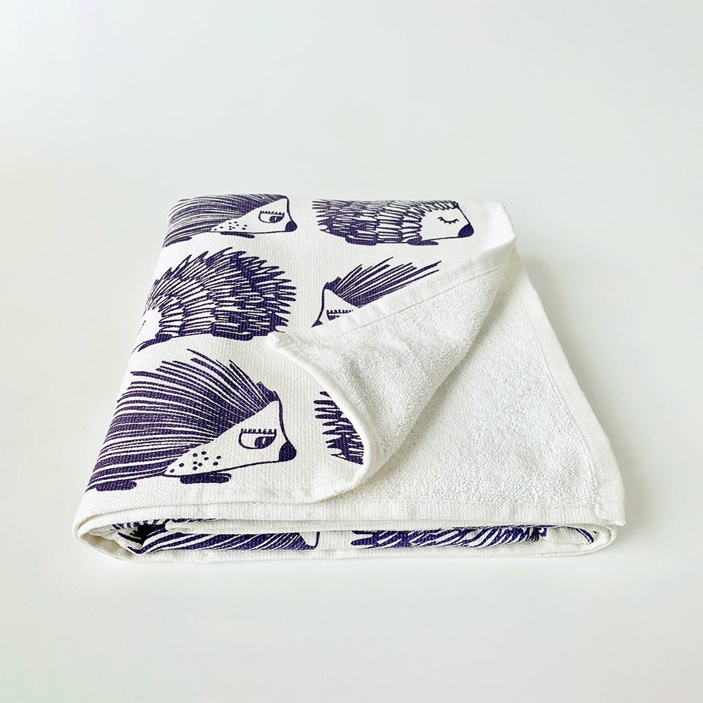 Mapayah cotton bath towel featuring a porcupine print, neatly folded to show the design, fabric quality, and softness.