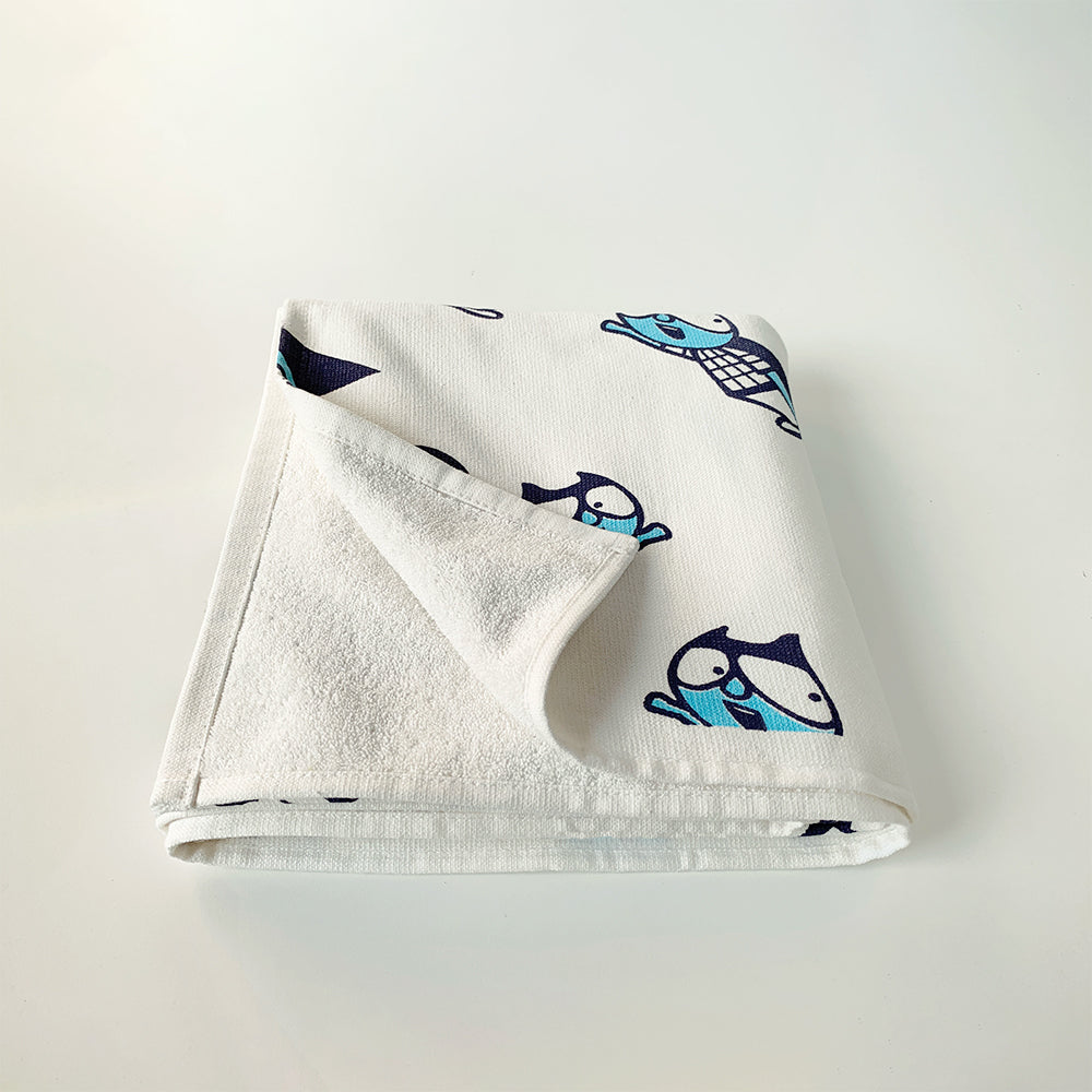 Mapayah cotton bath towel featuring a superhero print, neatly folded to show the design, fabric quality, and softness.



