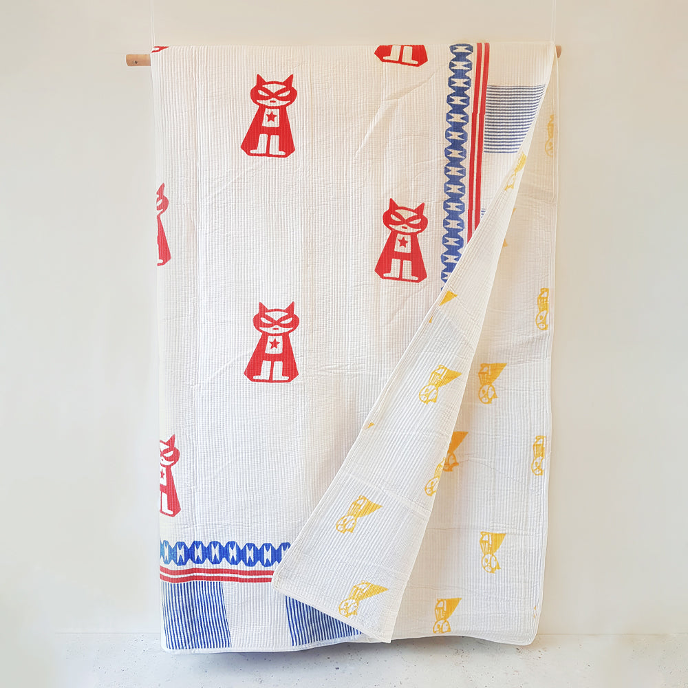 Mapayah COVER Superheroes kids bed cover shown hanging alongside folded cover