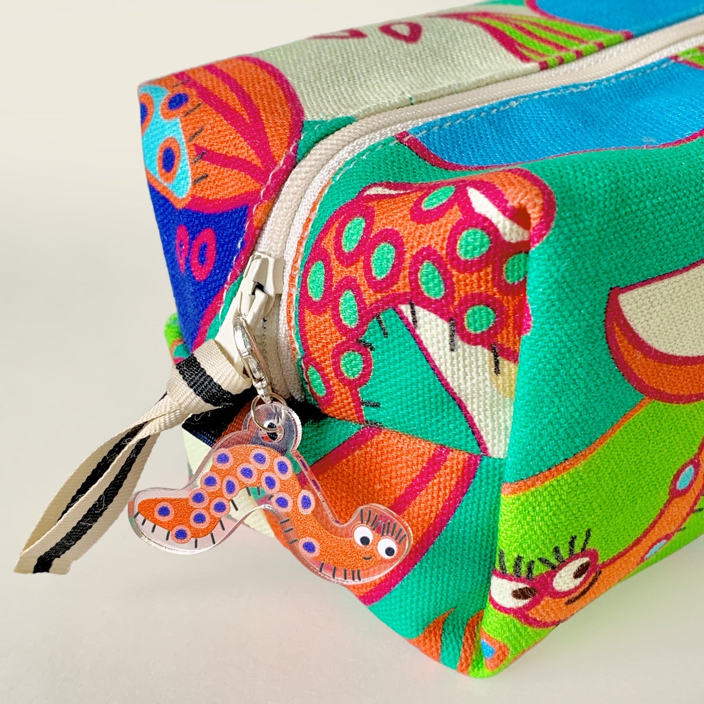 Mapayah CHARMS Wiggle keychain clipped onto a bag