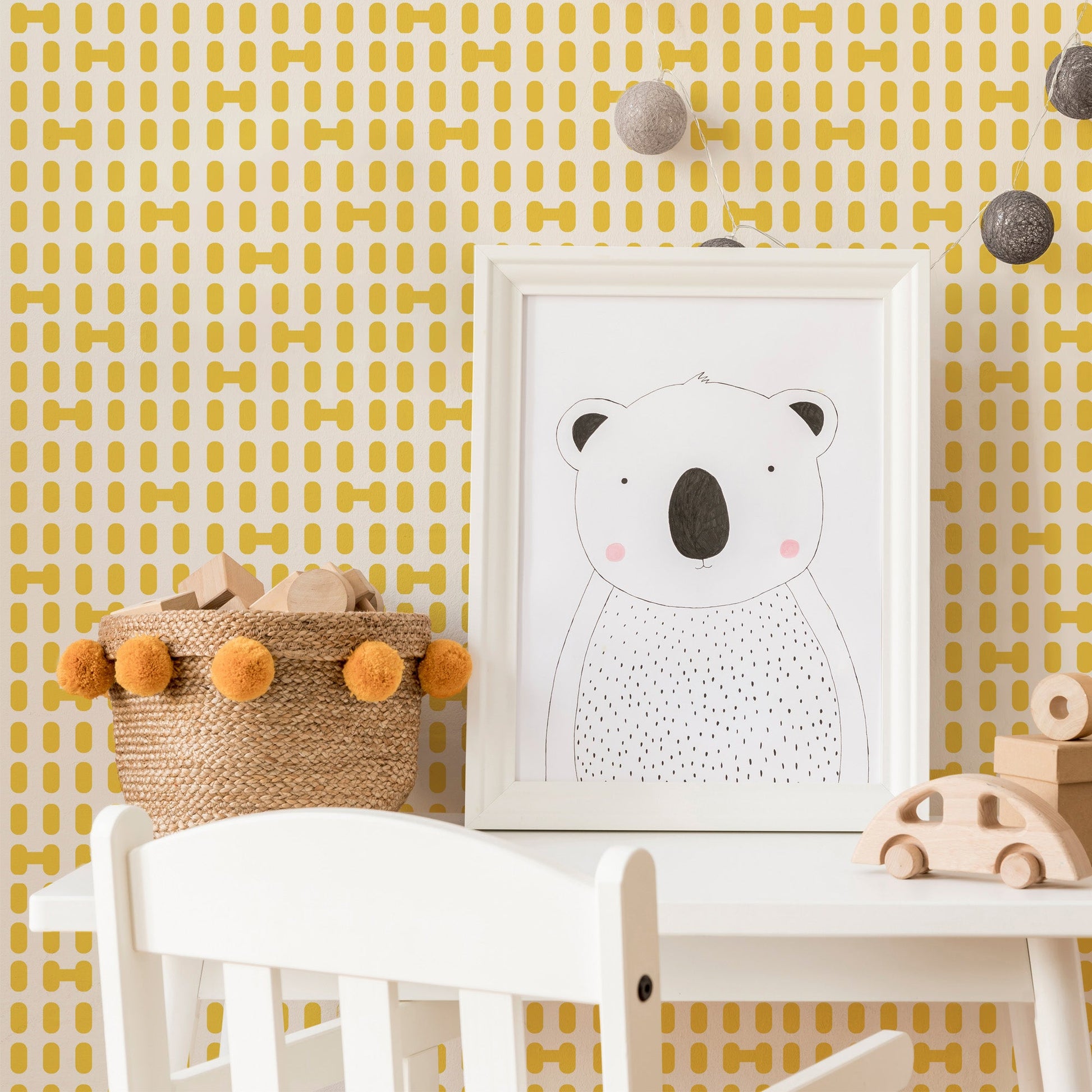 Mapayah DECK Dotz kids room wallpaper in yellow, styled in a bedroom setting