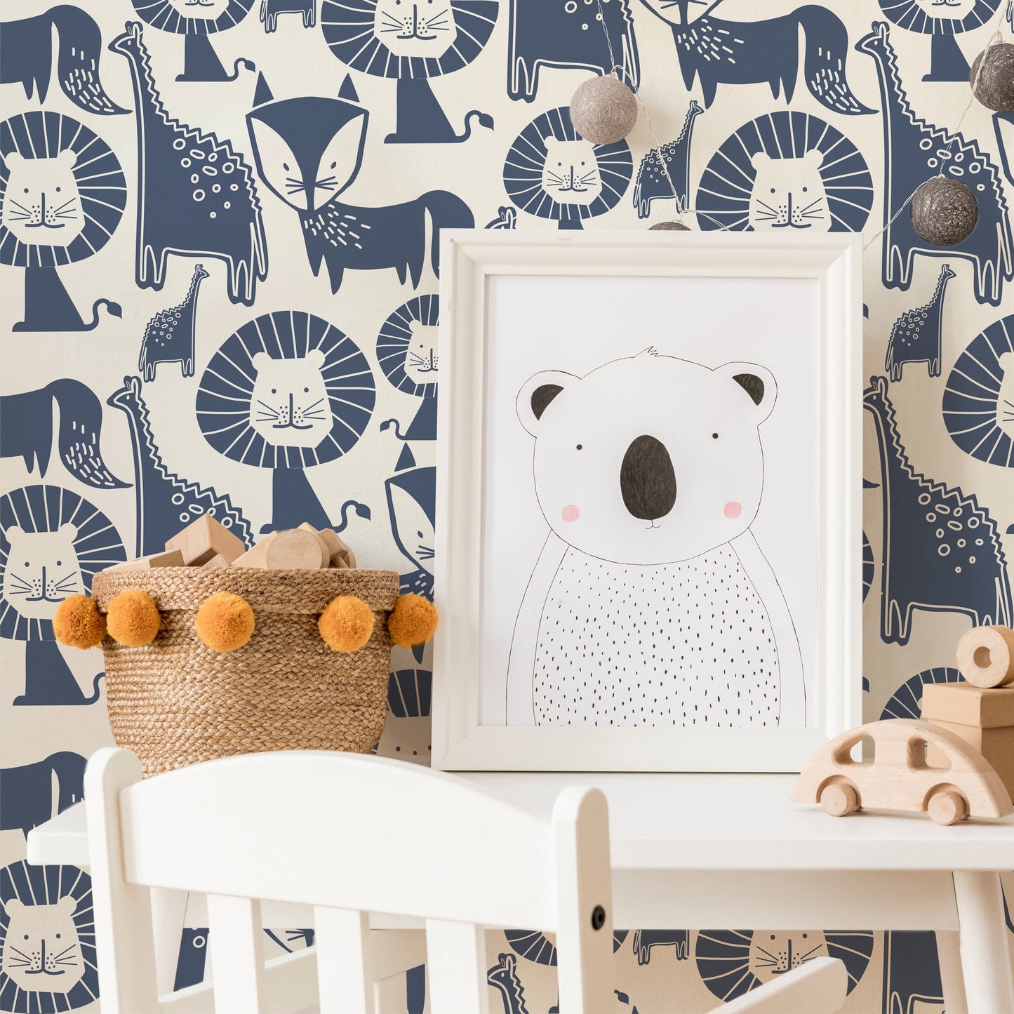 Mapayah DECK Jungle Mix kids room wallpaper in blue, styled in a bedroom setting