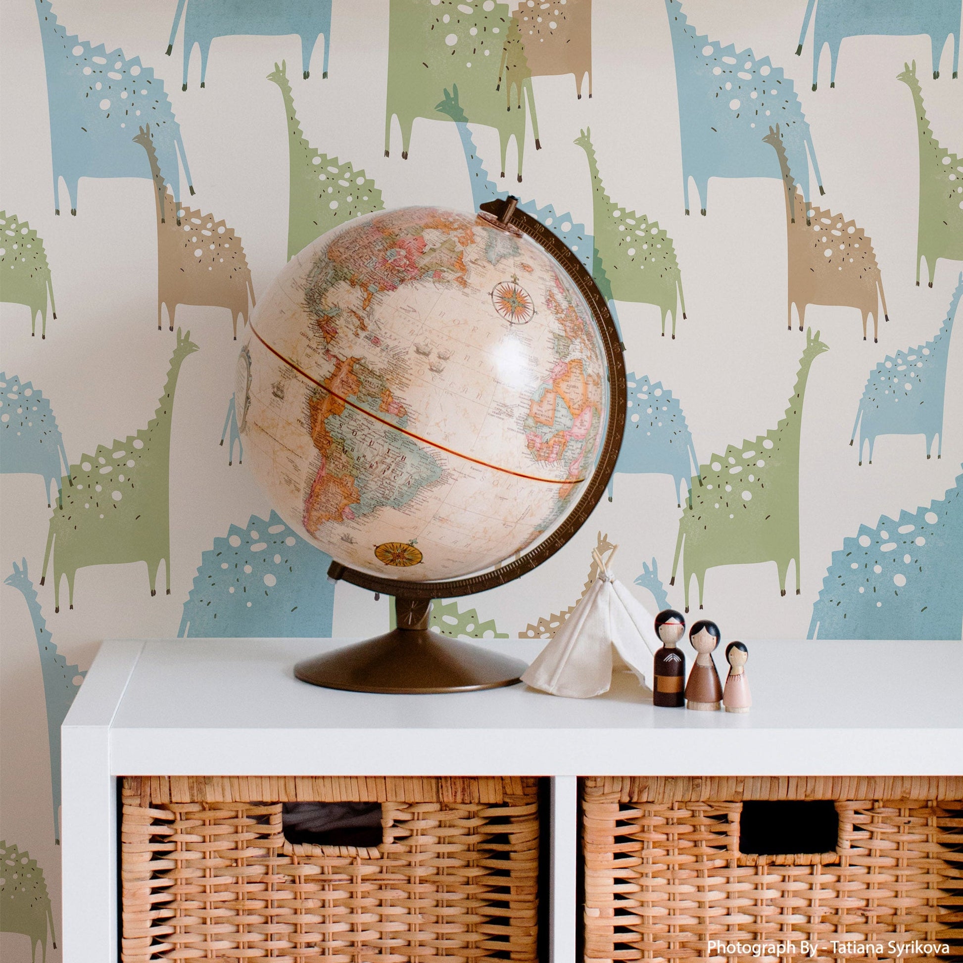 Mapayah DECK Jurassic kids room wallpaper in mild blue, styled in a bedroom setting
