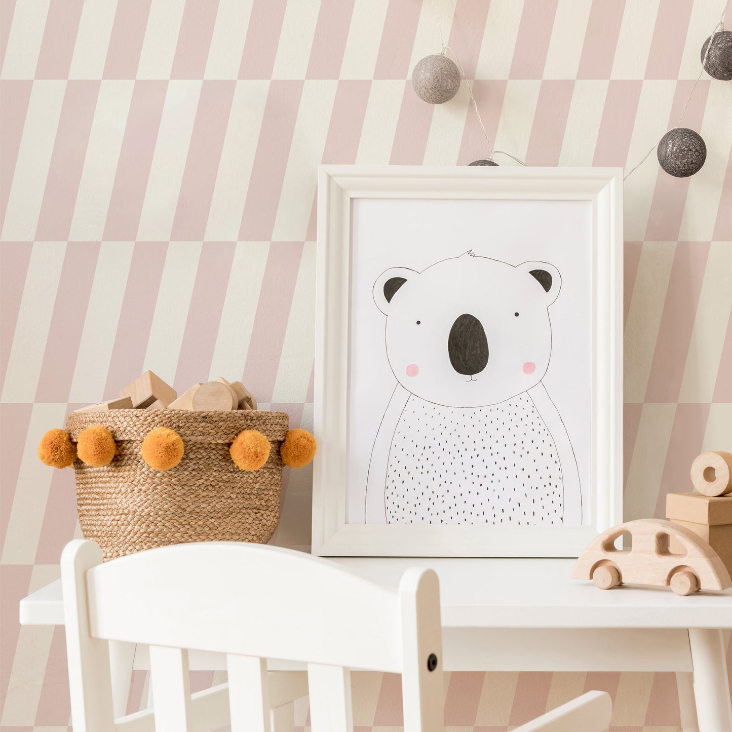 Mapayah DECK Tilt kids room wallpaper in pink, styled in a bedroom setting