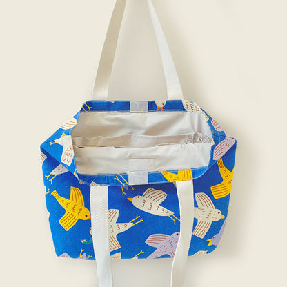 Mapayah FERRY Flap kids tote bag shown open, revealing bottle pouch and lining