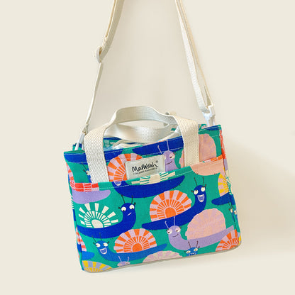 Mapayah PACK Glo kids lunch bag shown hanging by its shoulder strap
