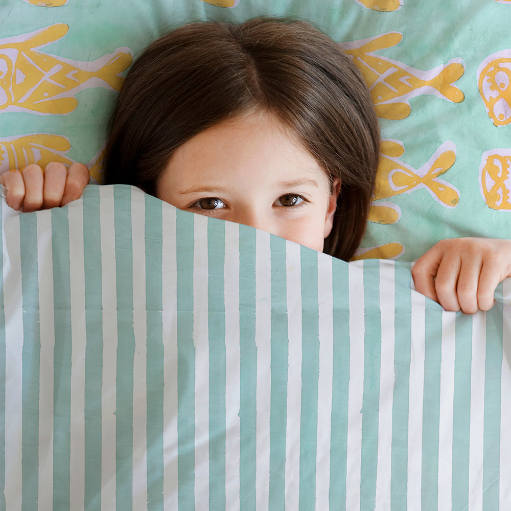 Mapayah SLEEP Bubbles bedding styled in a kids bedroom setting