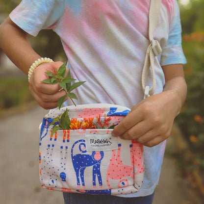 Mapayah SLING Munki kids cross-body bag styled in a lifestyle setting