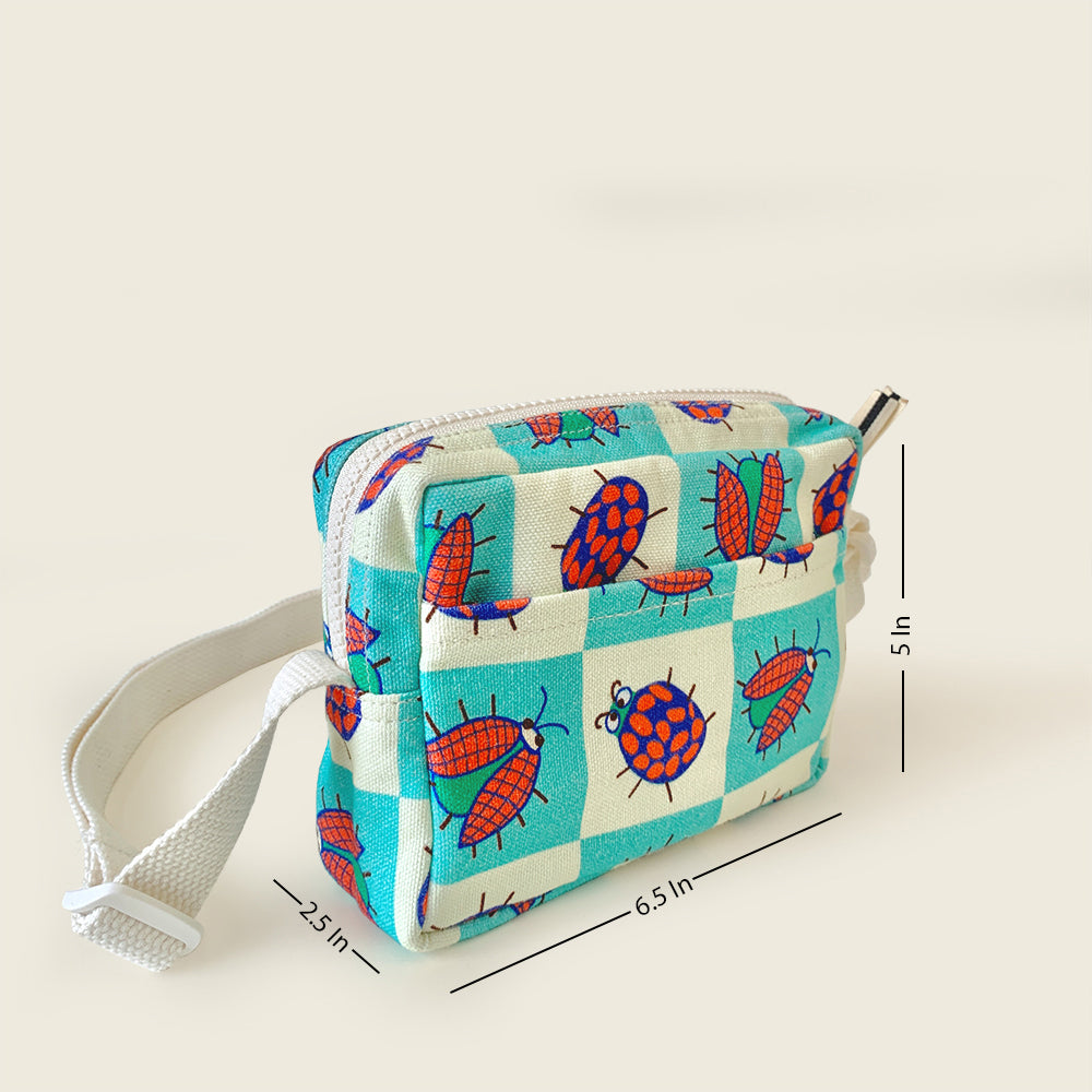 A small fabric pouch with a white strap, featuring a turquoise and white checkered pattern with red ladybugs. The image includes dimension lines indicating measurements.
