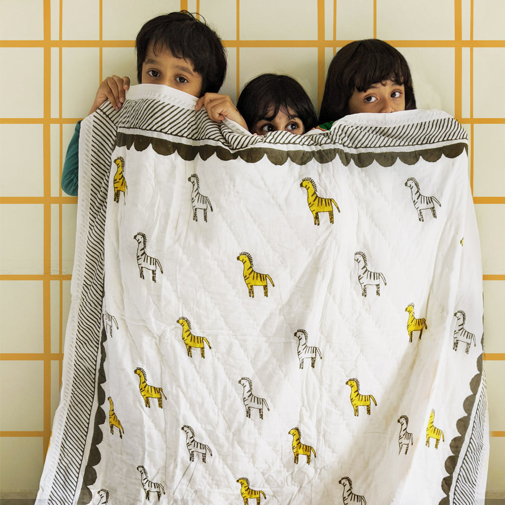 Mapayah SNUGGLE Zany Zebra kids blanket styled in a bedroom setting