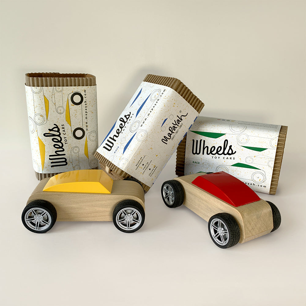 Mapayah WHEELS wooden kids toy car styled in a lifestyle room setting