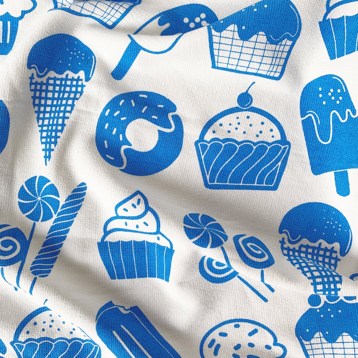 Close-up of candy print on Mapayah WRAP Candy Blue kids bath towel