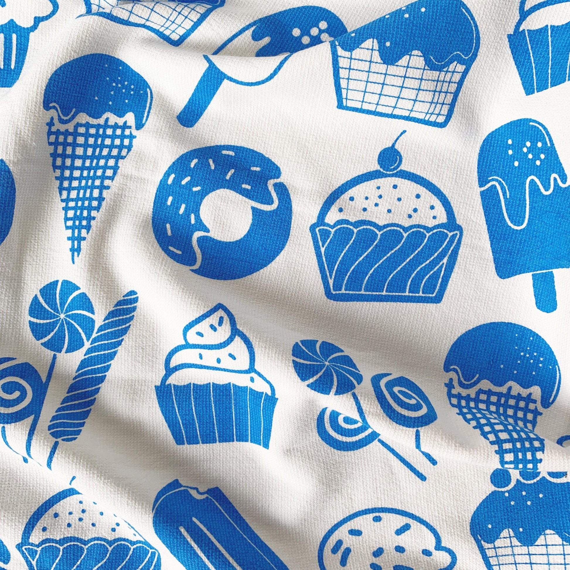 Close-up of candy print on Mapayah WRAP Candy Blue kids bath towel