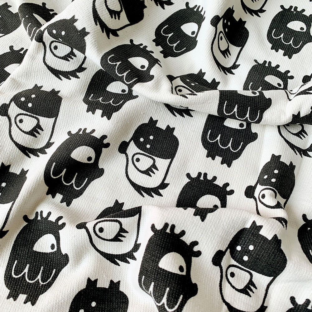 Close-up of Oddlings print on Mapayah WRAP Oddlings Grey kids bath towel