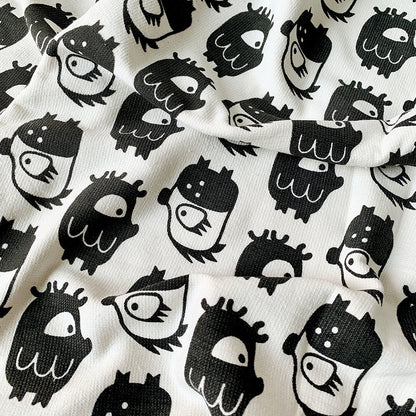 Close-up of Oddlings print on Mapayah WRAP Oddlings Grey kids bath towel
