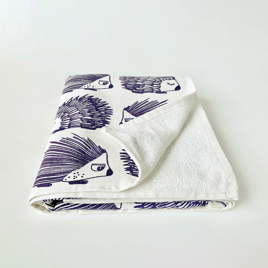 Mapayah cotton bath towel featuring a porcupine print, neatly folded to show the design, fabric quality, and softness.