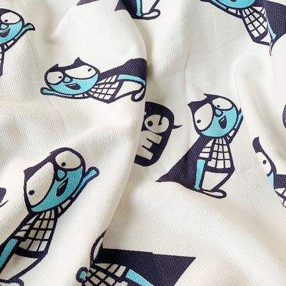A close up of a Mapayah cotton bath towel featuring a superhero print, neatly folded to show the design, fabric quality, and softness.